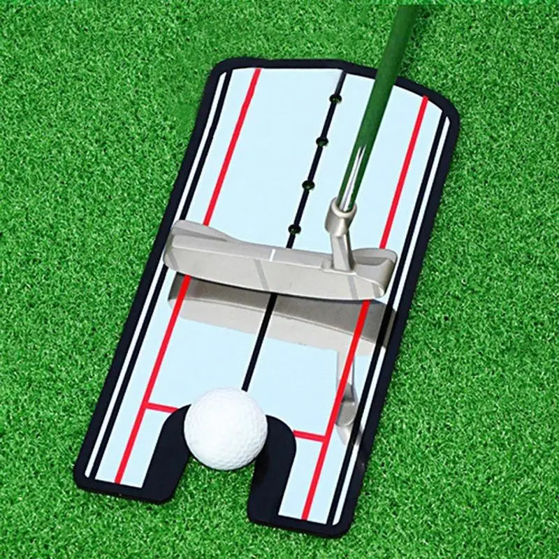 Golf putter and ball on a practice mat with a green grass background